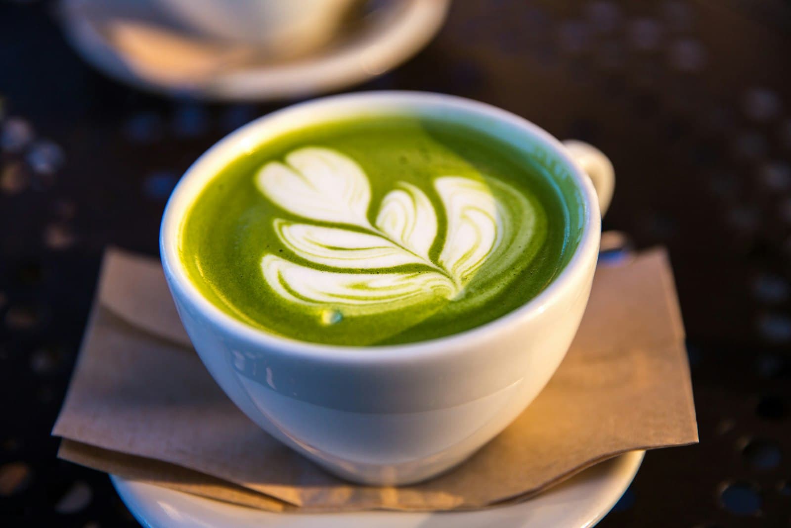 Whisking matcha into a frothy bowl